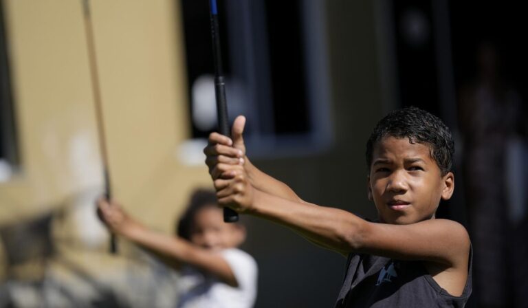 Golf takes Brazilian kids from mean streets to putting greens
