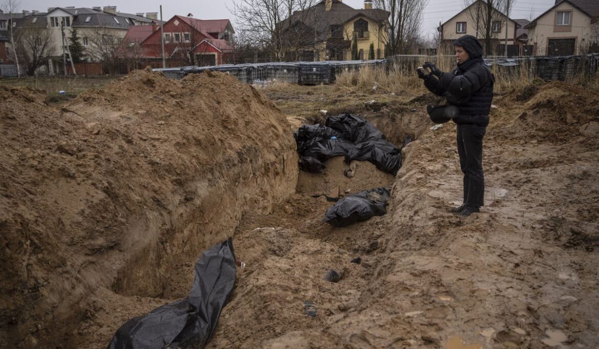 Bodies, mass grave found near Kyiv; Zelenskyy says Russians carried out ‘genocide’