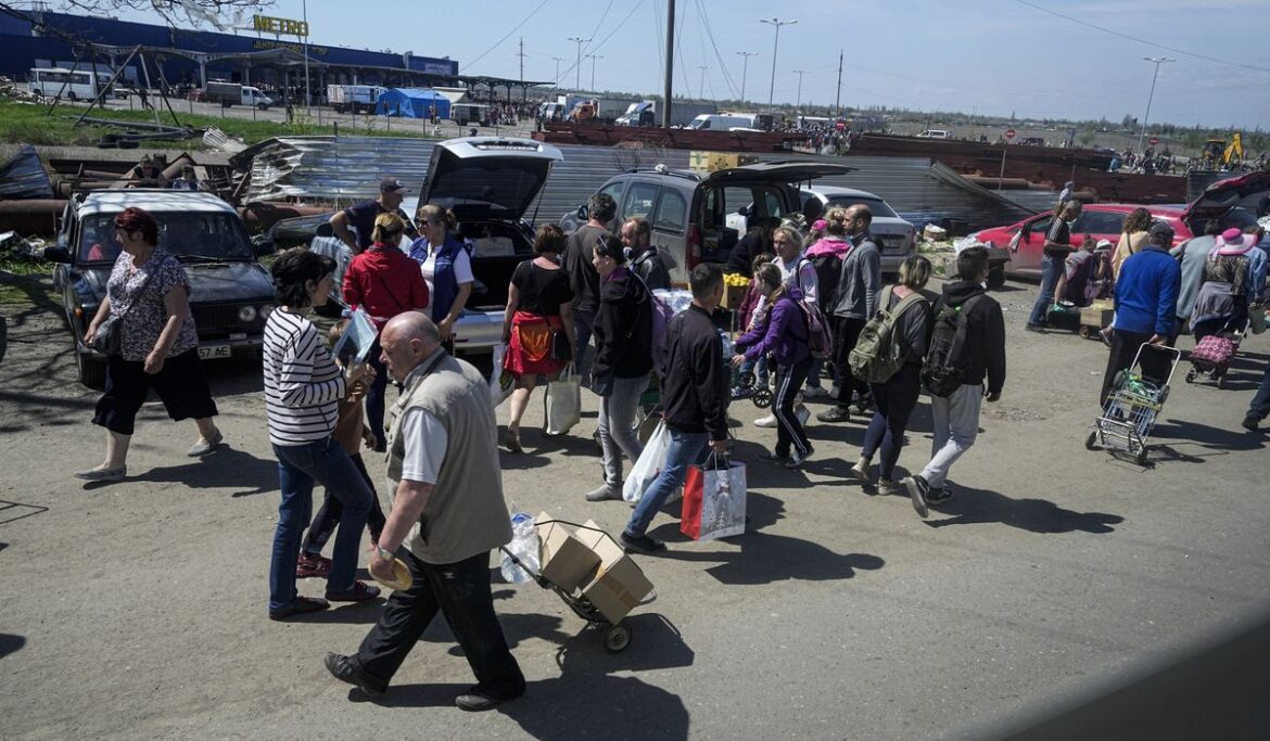 Civilian evacuation from besieged Ukrainian port of Mariupol underway, officials say