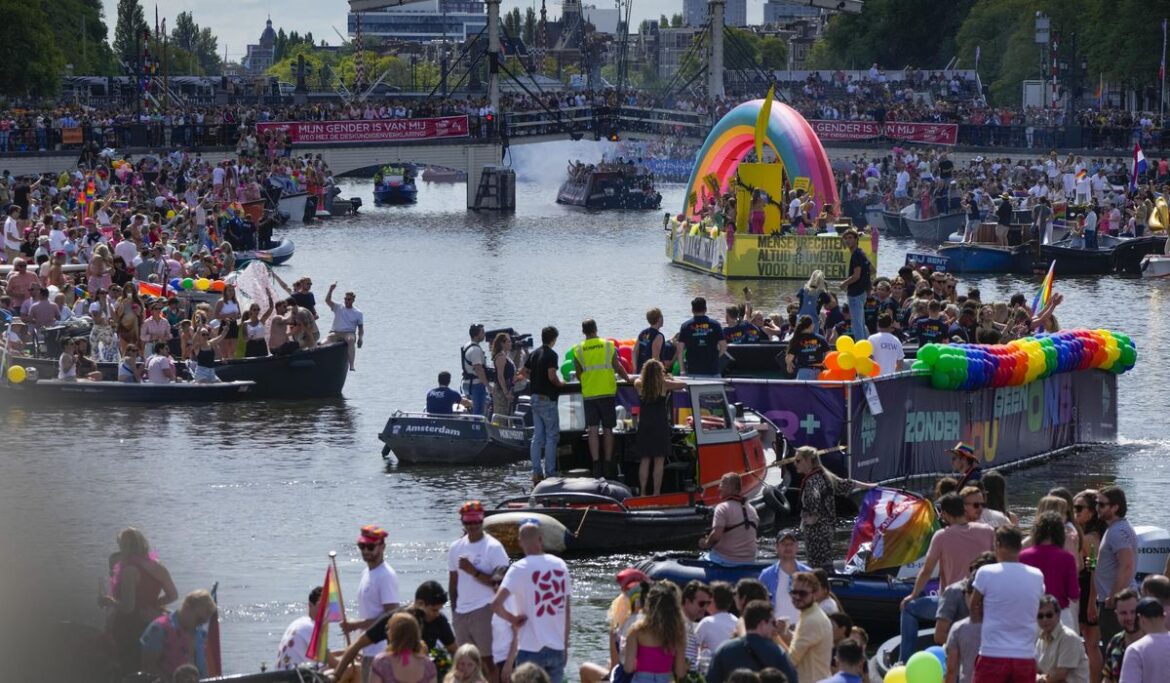 Huge crowds watch Amsterdam Pride’s canal parade celebration